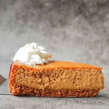pumpkin spice cheesecake topped with whipped cream