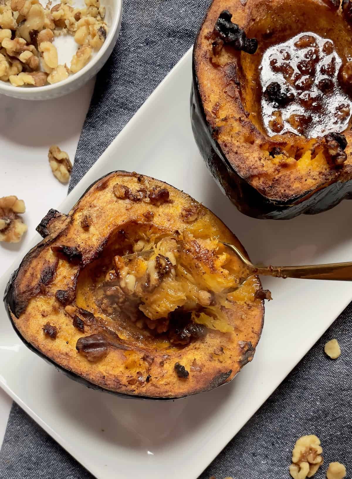 acorn squash with honey butter sauce and walnuts