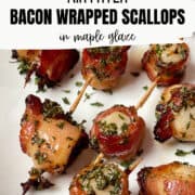 bacon wrapped scallops on a white plate