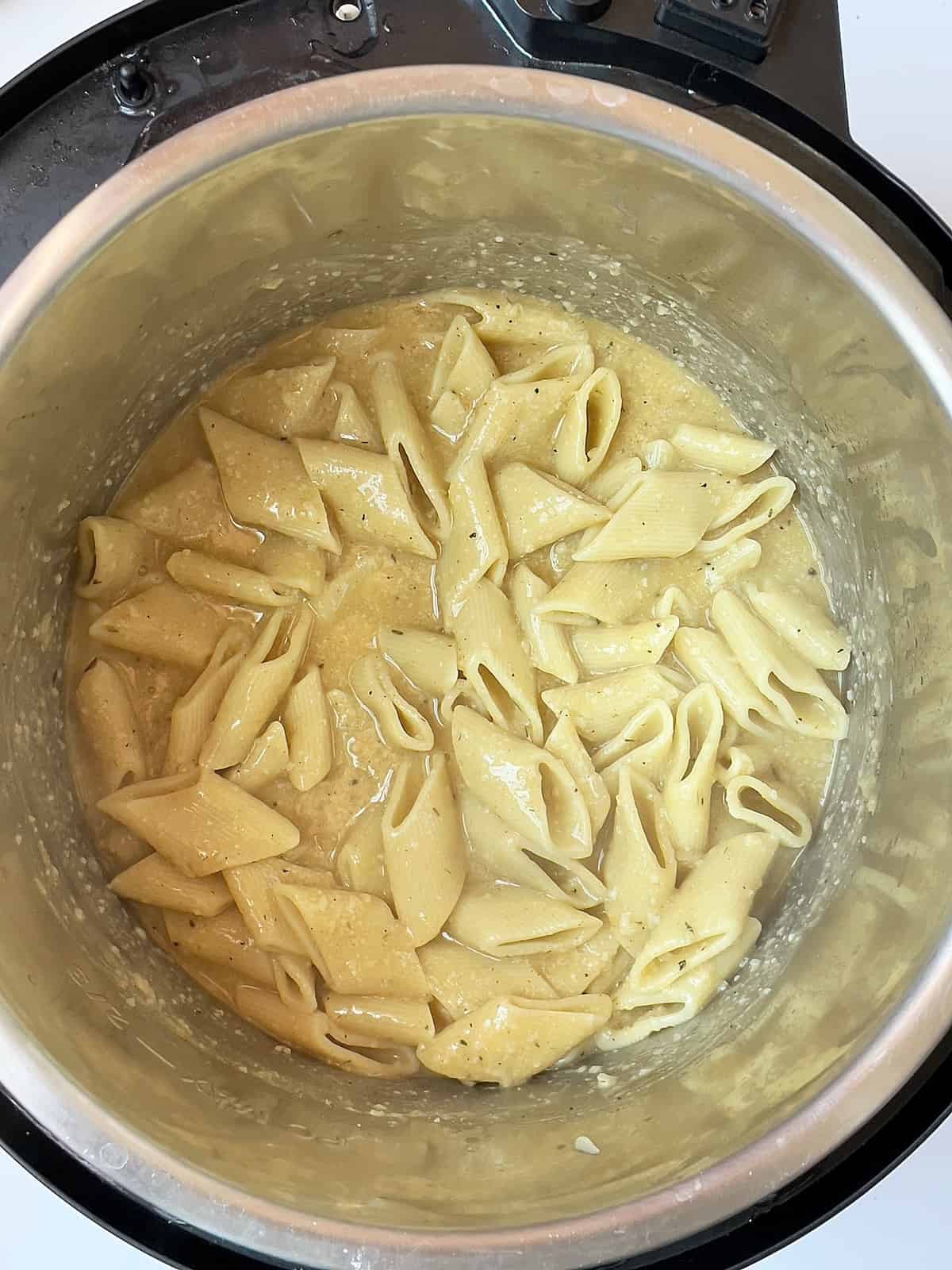acorn squash pasta cooked and mixed with cheese in the pressure cooker