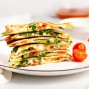 mediterranean quesadilla stacked on a plate