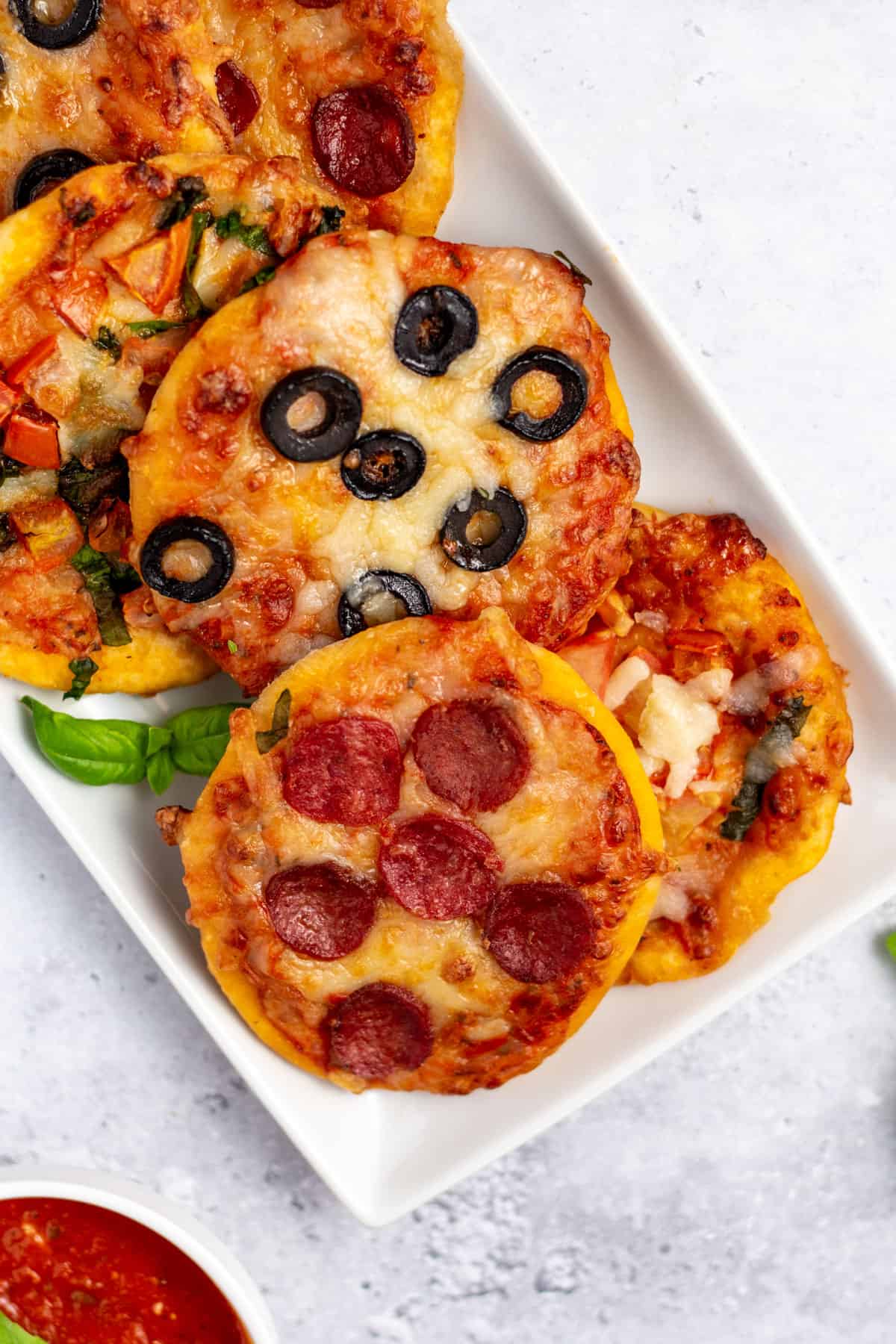 little pizzas on a white plate