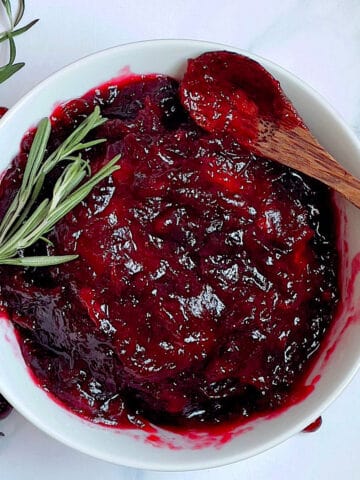 pressure cooker cranberry sauce in a small white bowl