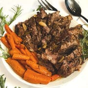 pressure cooker leg of lamb in a white bowl