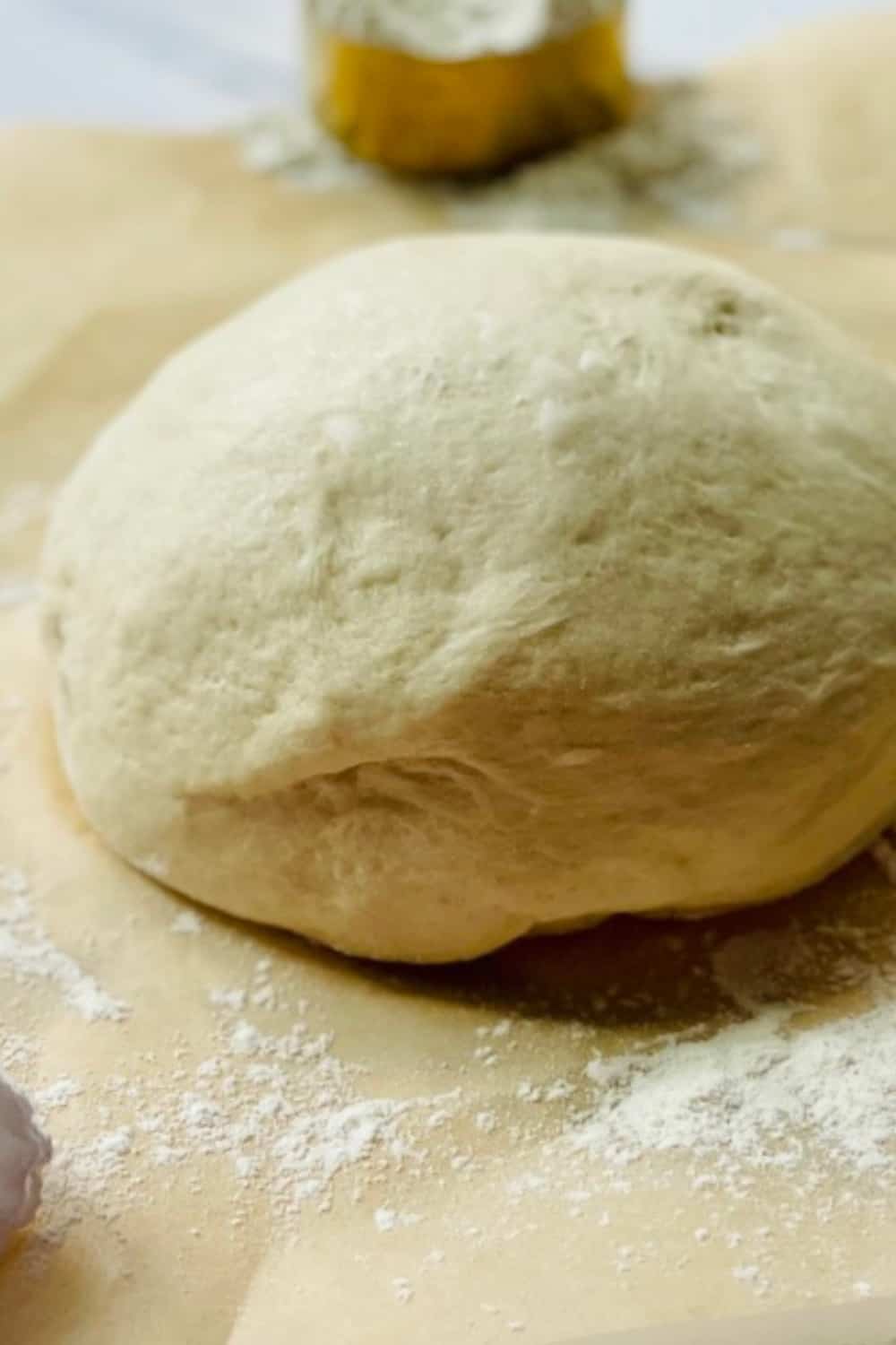 best flour for pizza dough ball on parchment paper