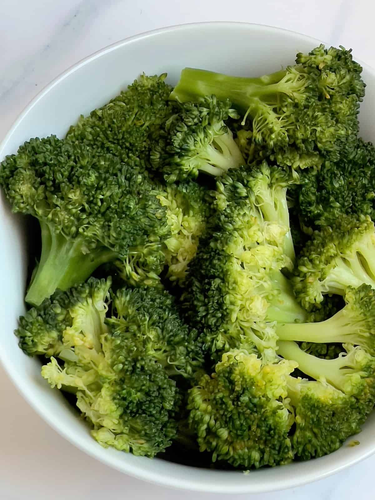 Instant pot broccoli in a white plate