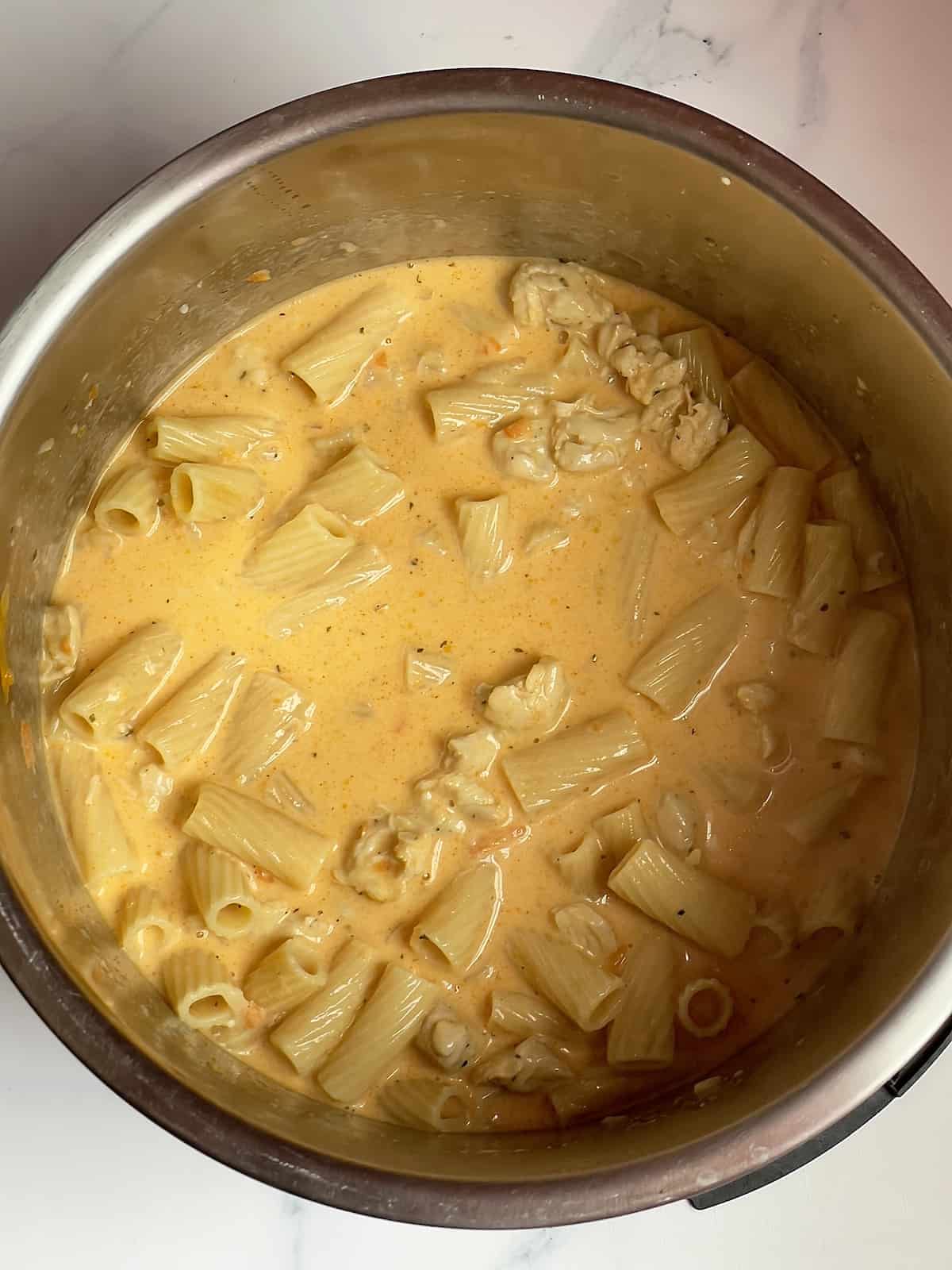 thickened instant pot buffalo chicken pasta in the inner pot
