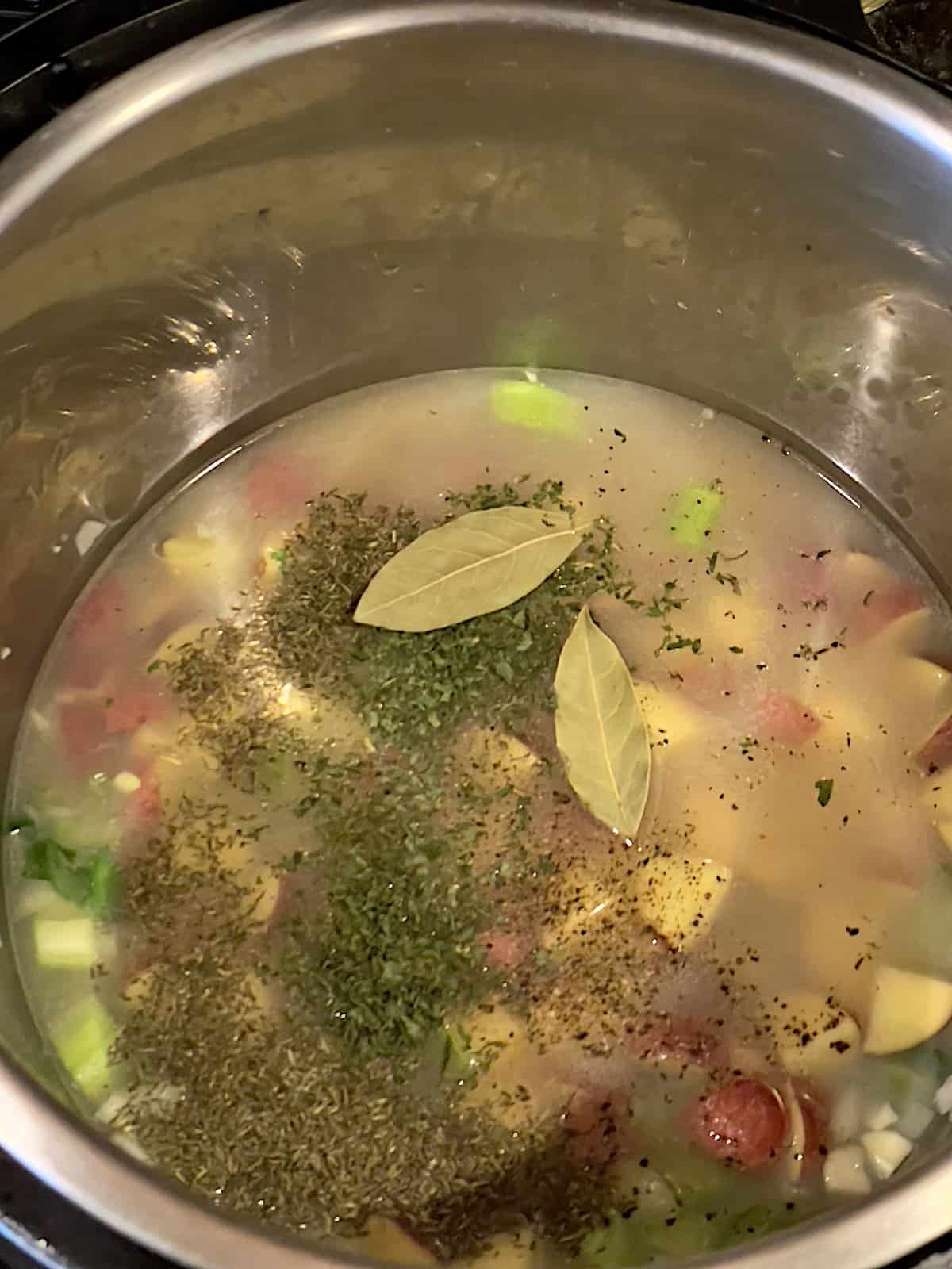 potatoes, clam juice, chicken broth, seasonings and vegetables in a pressure cooker