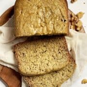 bread machine banana bread sliced on a cutting board