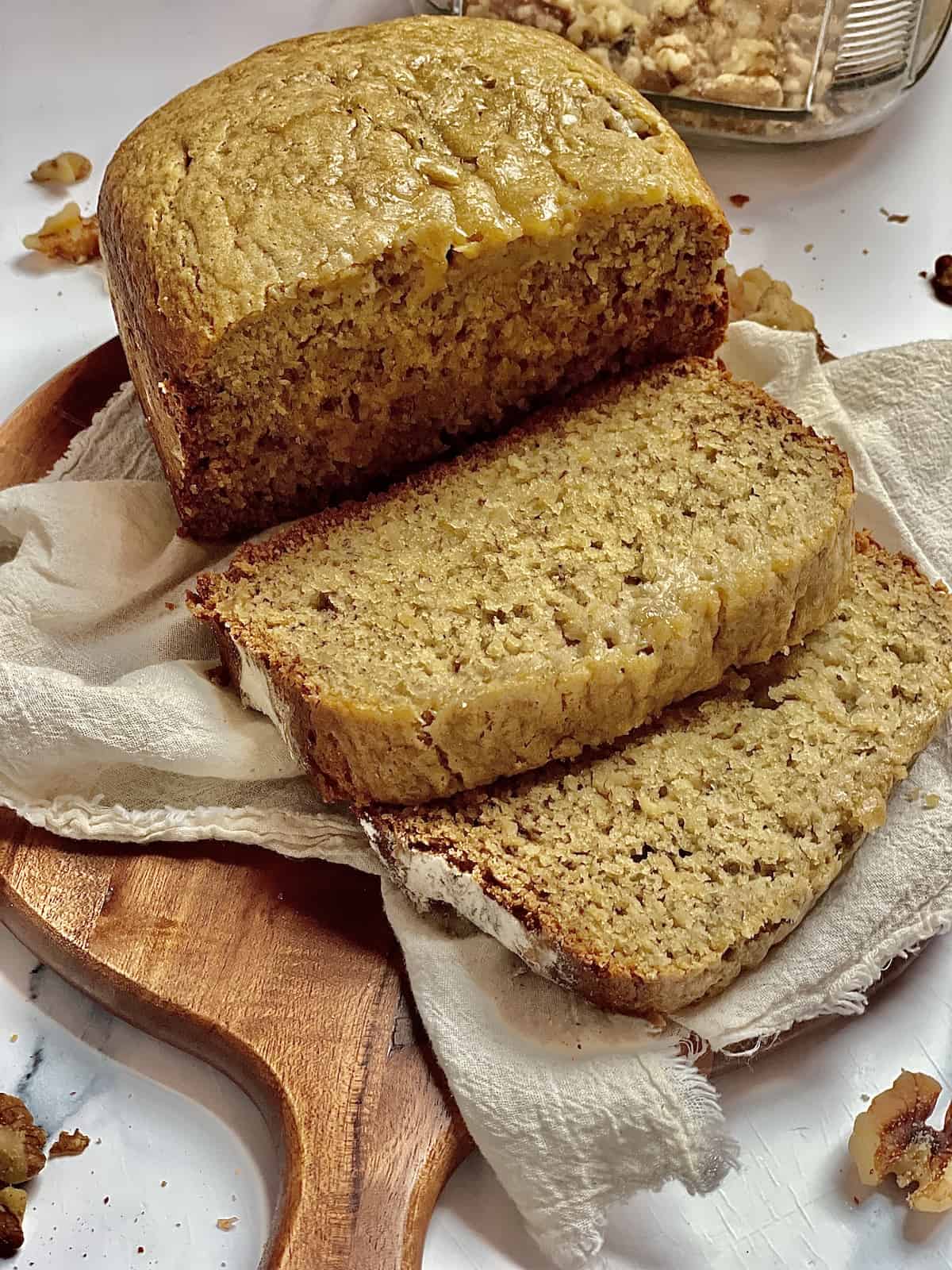 bread machine banana bread sliced on a cutting board