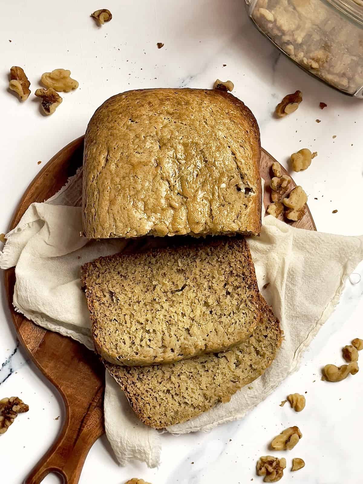 bread machine banana bread sliced on a cutting board