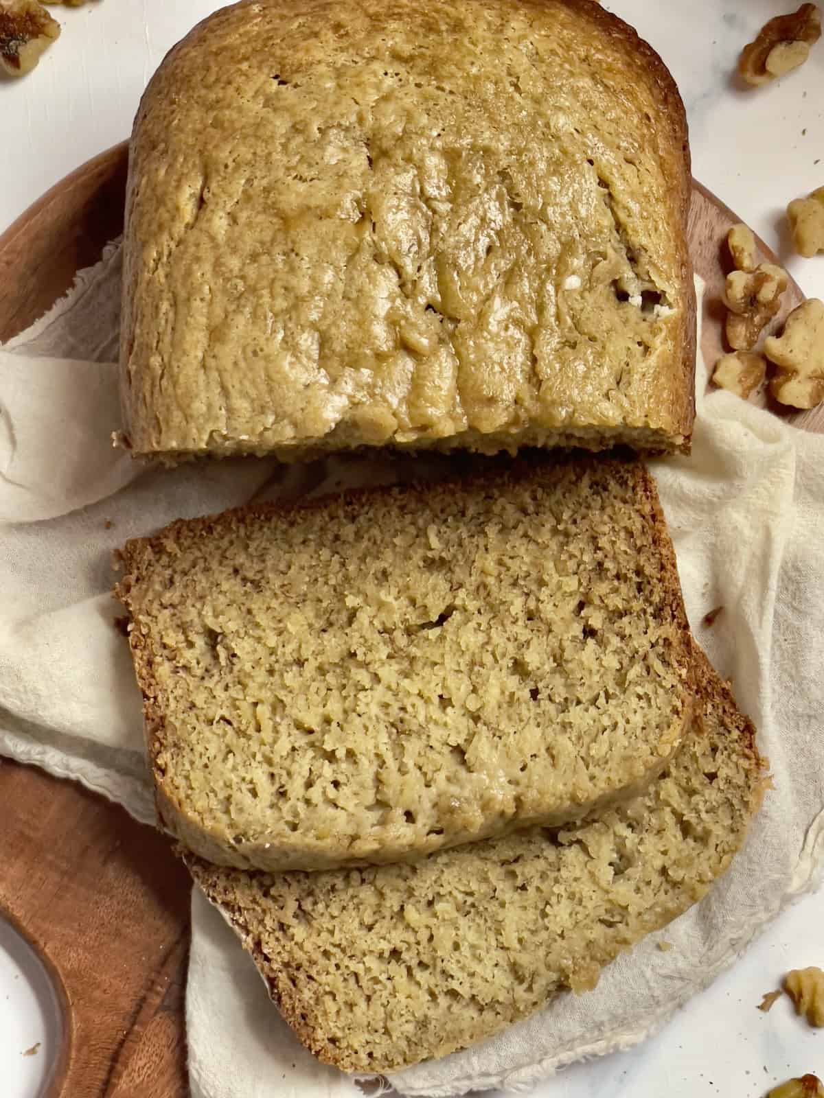 bread machine banana bread sliced on a cutting board