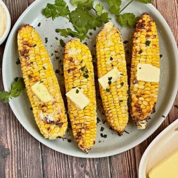 air fried corn on the cob topped with butter and herbs