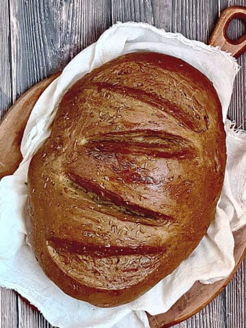 bread machine rye bread on a cutting board