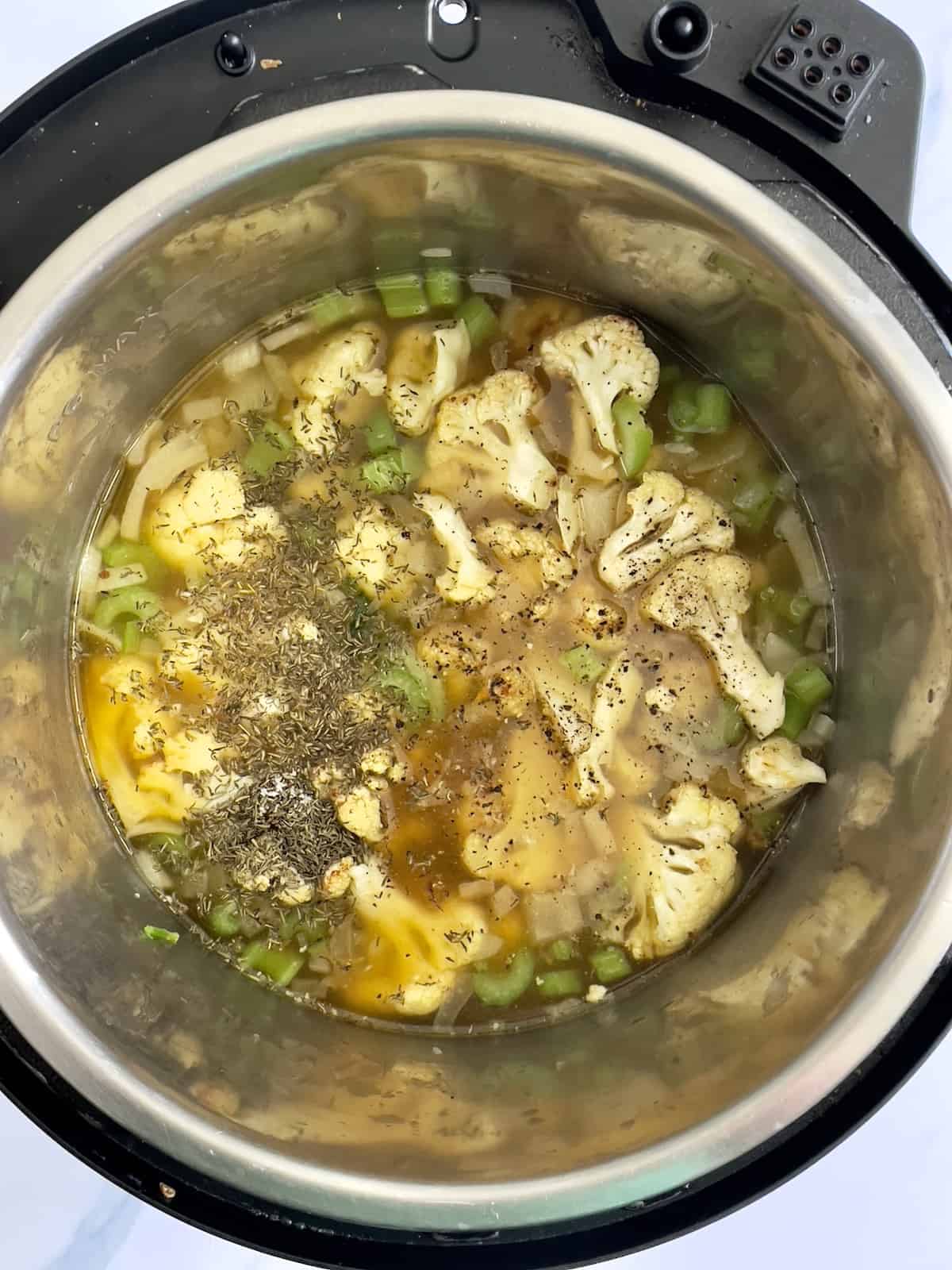 uncooked cauliflower soup in the pressure cooker