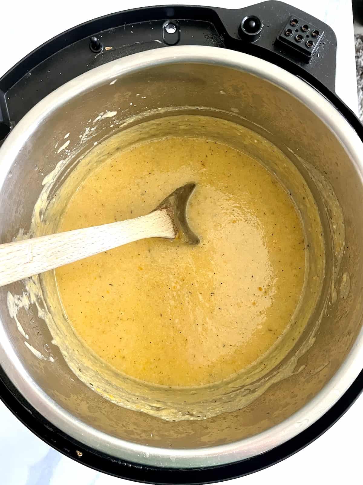 shredded cheese mixed into cauliflower soup