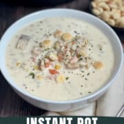 instant pot seafood chowder in a white bowl with oyster crackers