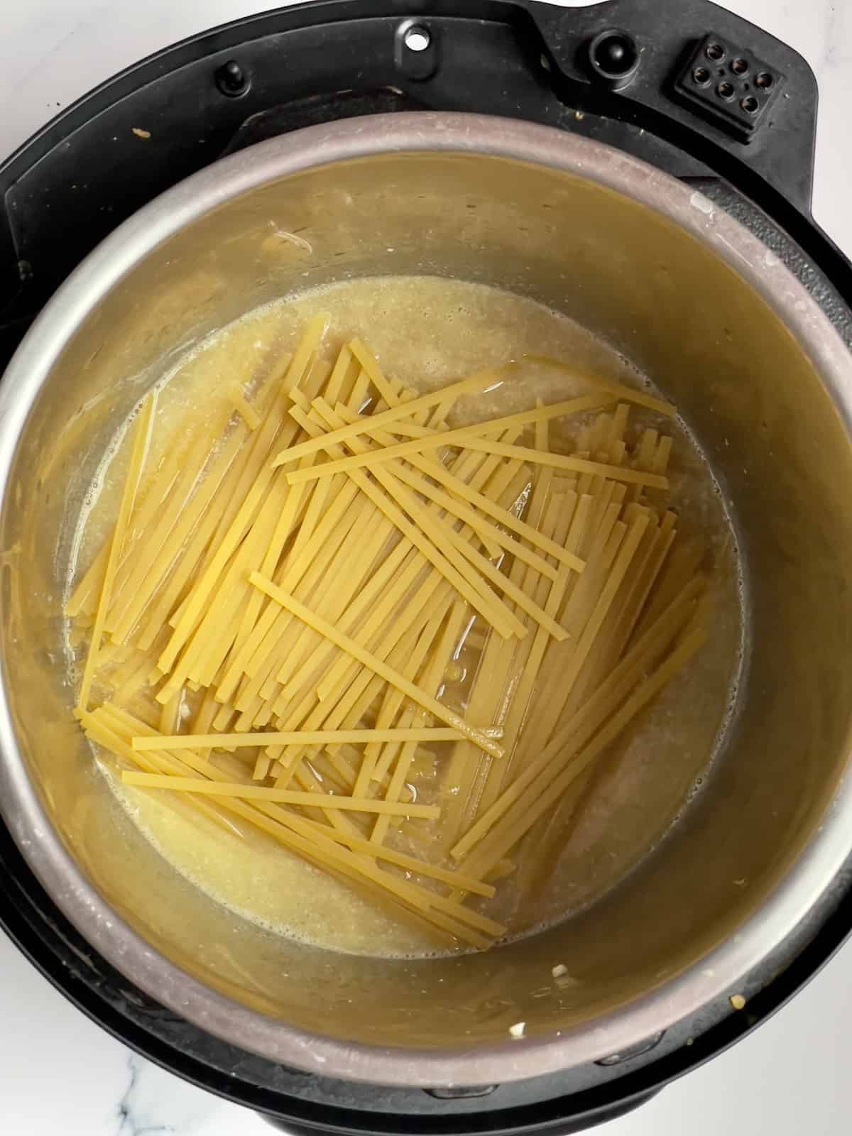 fettuccine pasta in an inner pot