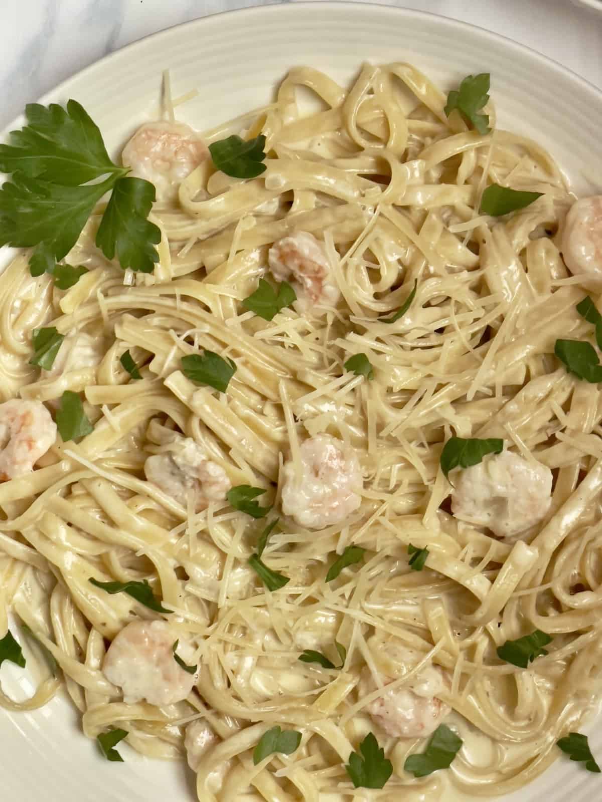 instant pot shrimp alfredo topped with parsley