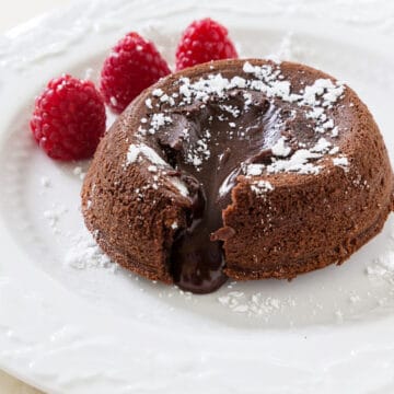 instant pot lava cake with raspberries and powdered sugar