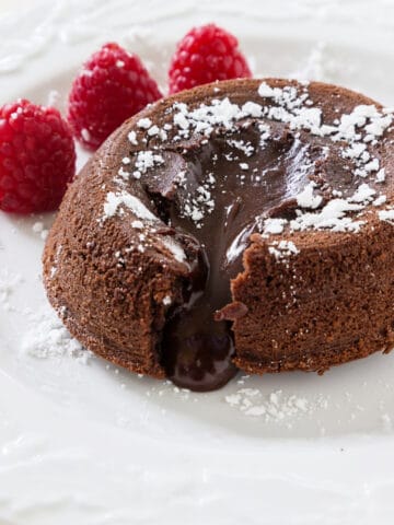 instant pot lava cake with raspberries and powdered sugar