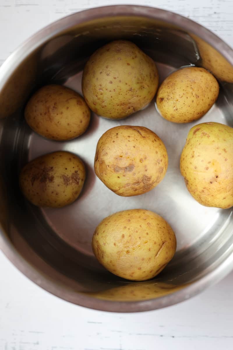 whole golden potatoes in a pressure cooker