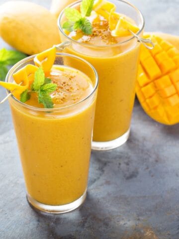 mango shake in 2 glasses