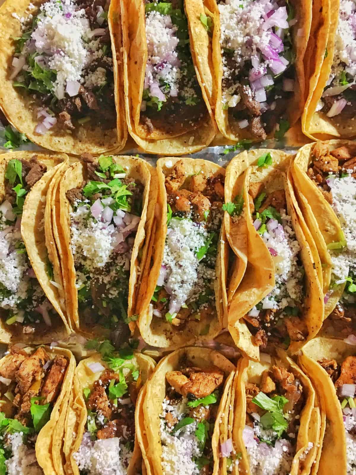 open faced taco shells stuffed with birra meat, cilantro and diced onions