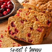 slices of cranberry orange bread sliced on a cutting board