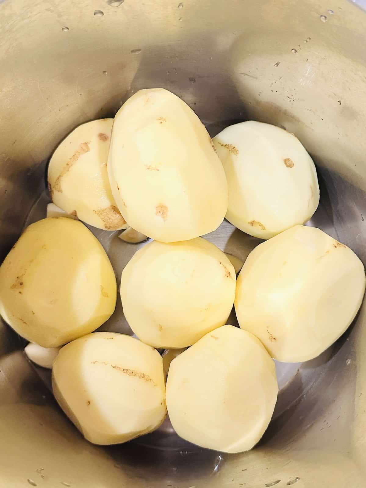whole peeled gold potatoes and garlic in the pressure cooker inner pot