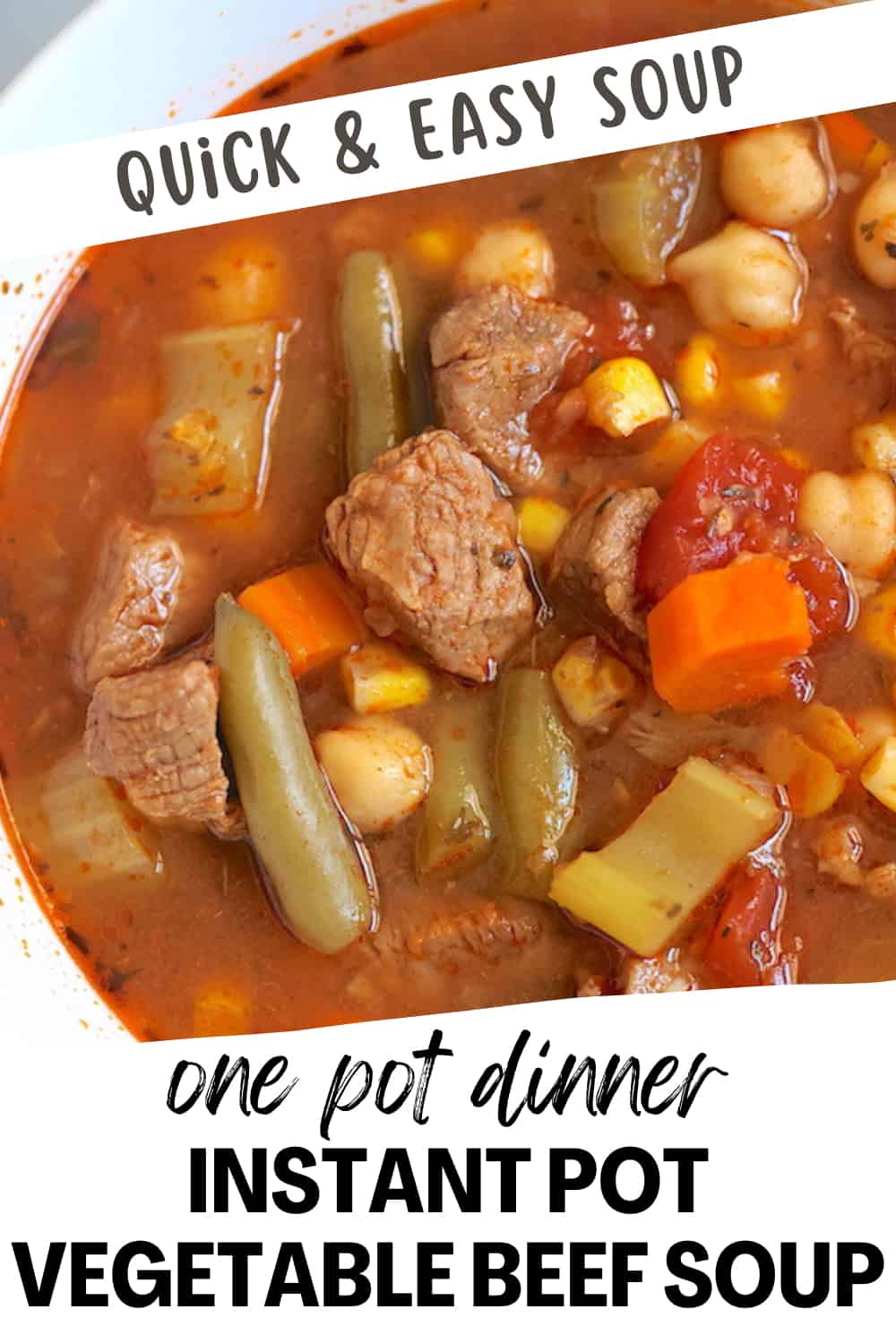 instant pot vegetable beef soup in a white bowl on a gray plate pinnable image