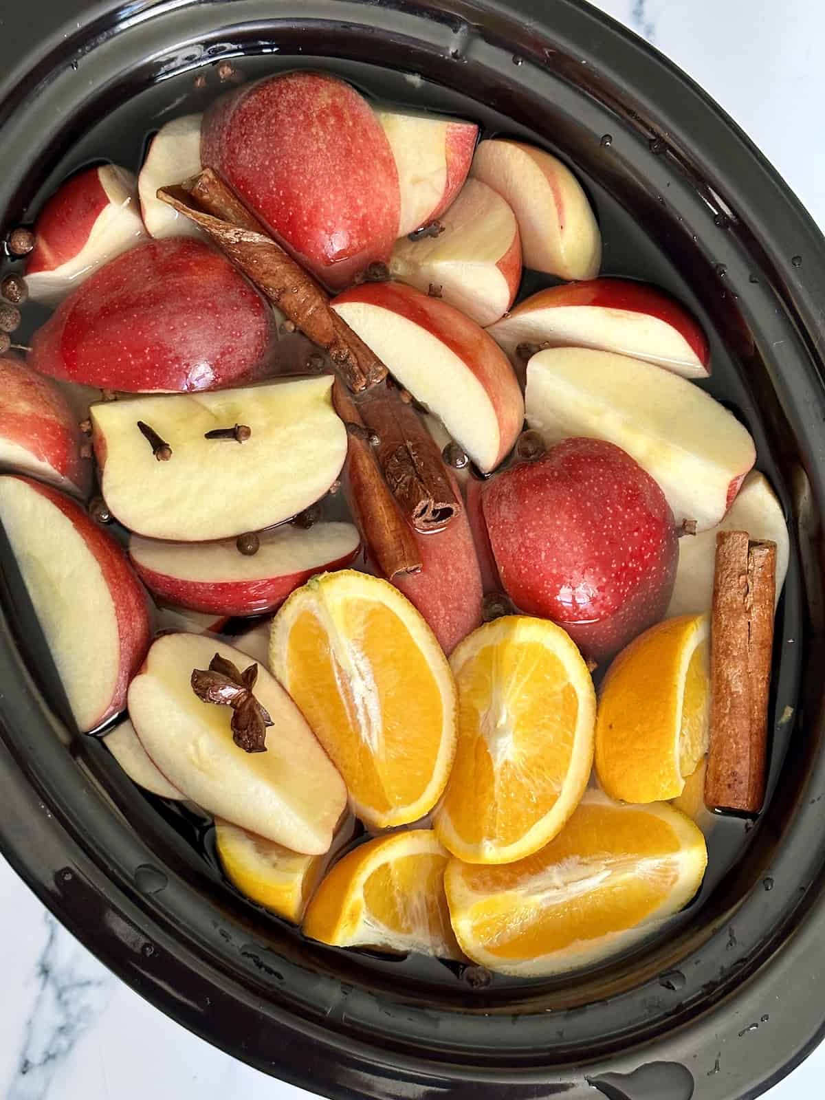 crockpot apple cider fruit and whole seasonings cooking