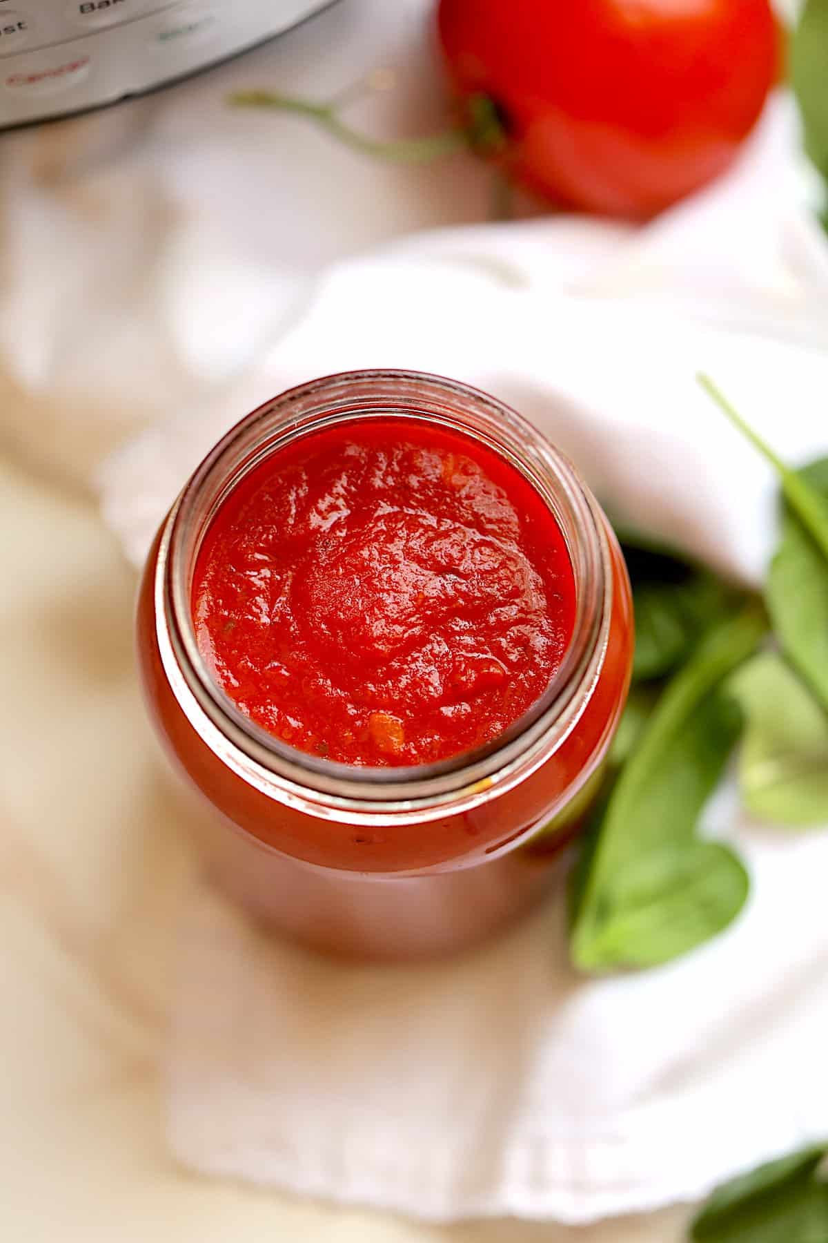 top view of marinara sauce in a mason jar