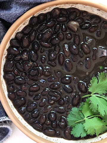 instant pot mexican black beans in a bowl with cilantro