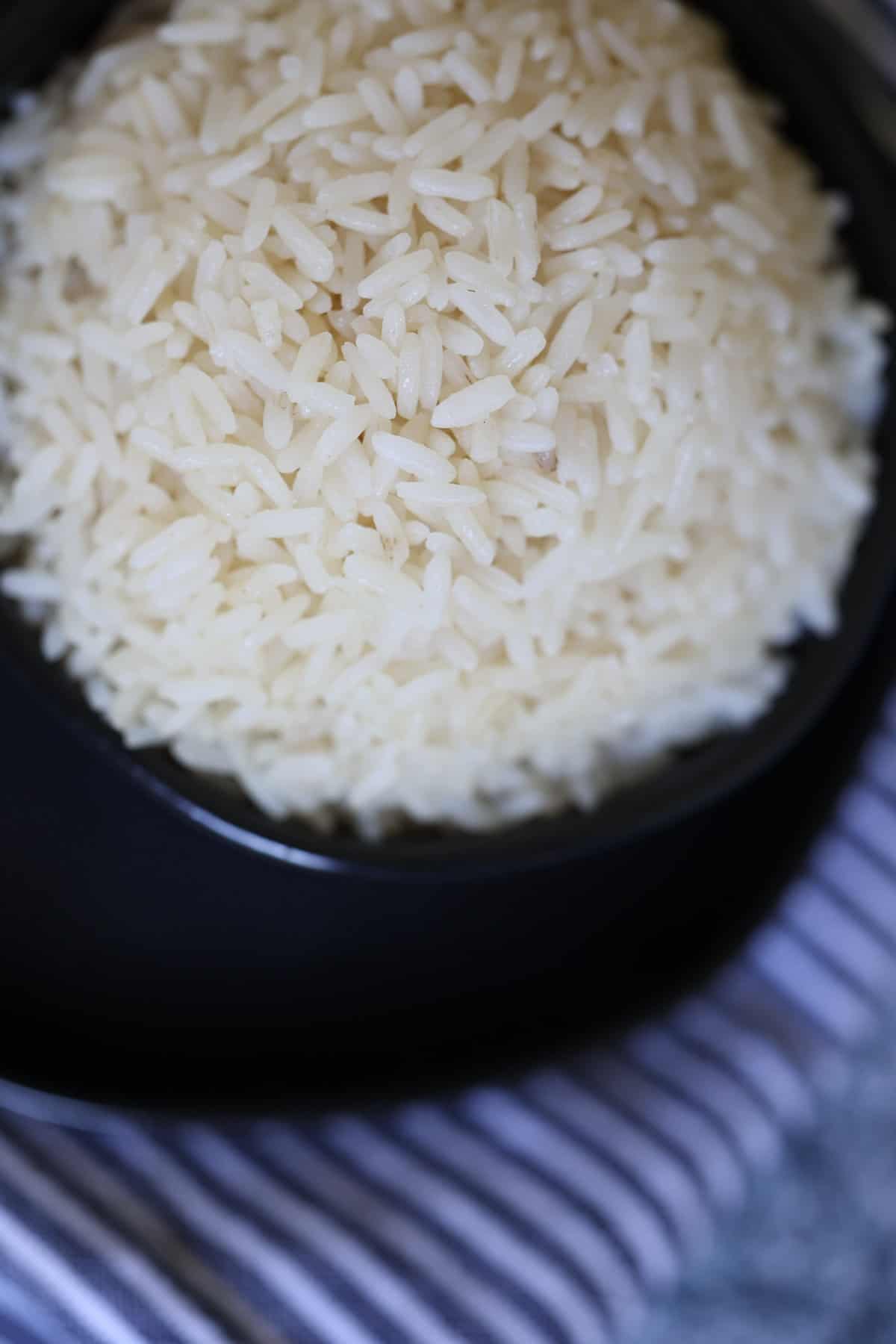 close up of instant pot parboiled rice in a black bowl