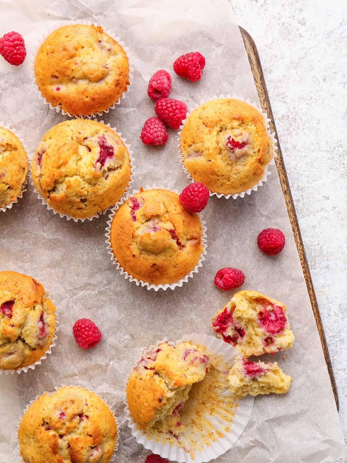 dairy-free raspberry muffins on parchment paper