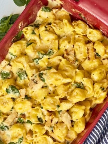 chicken tortellini baked in a casserole with spinach