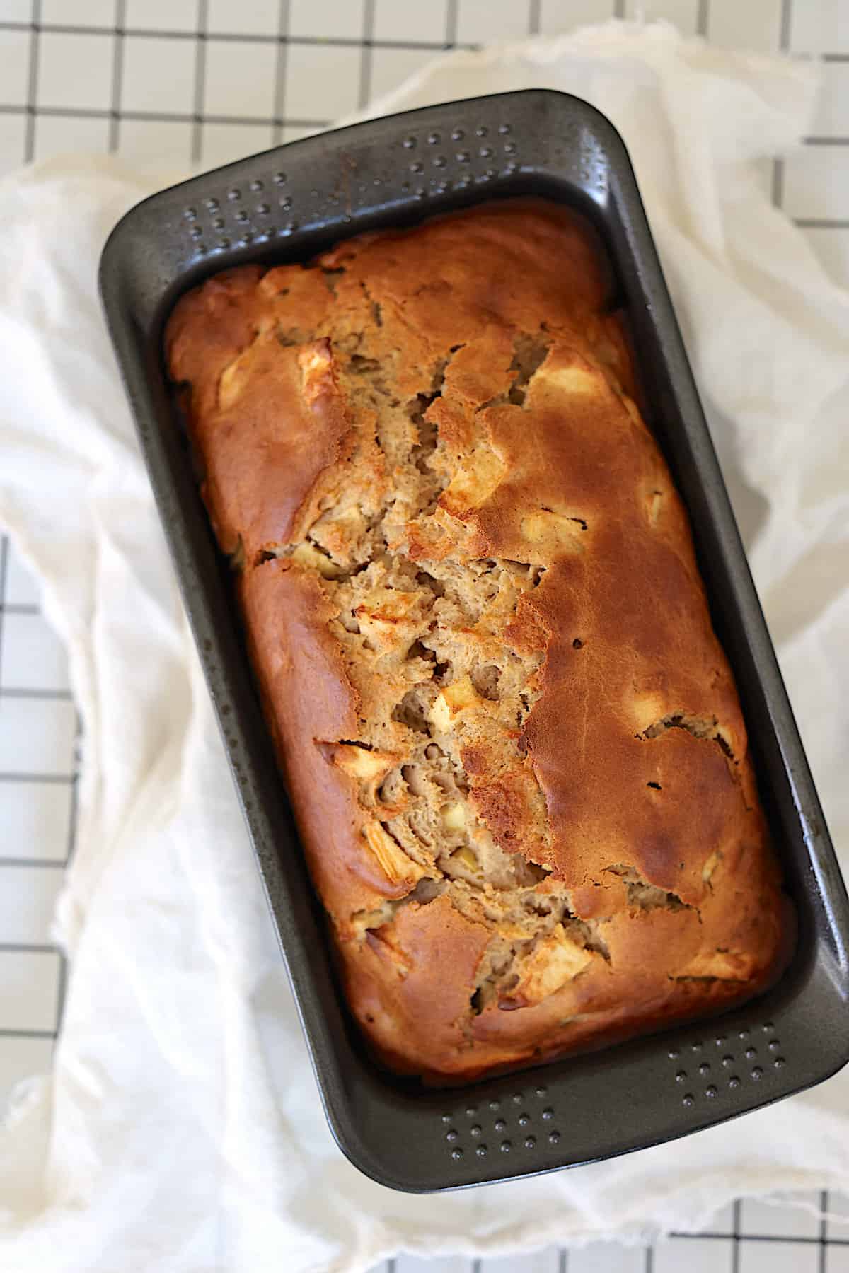 cooked apple loaf in a bread pan