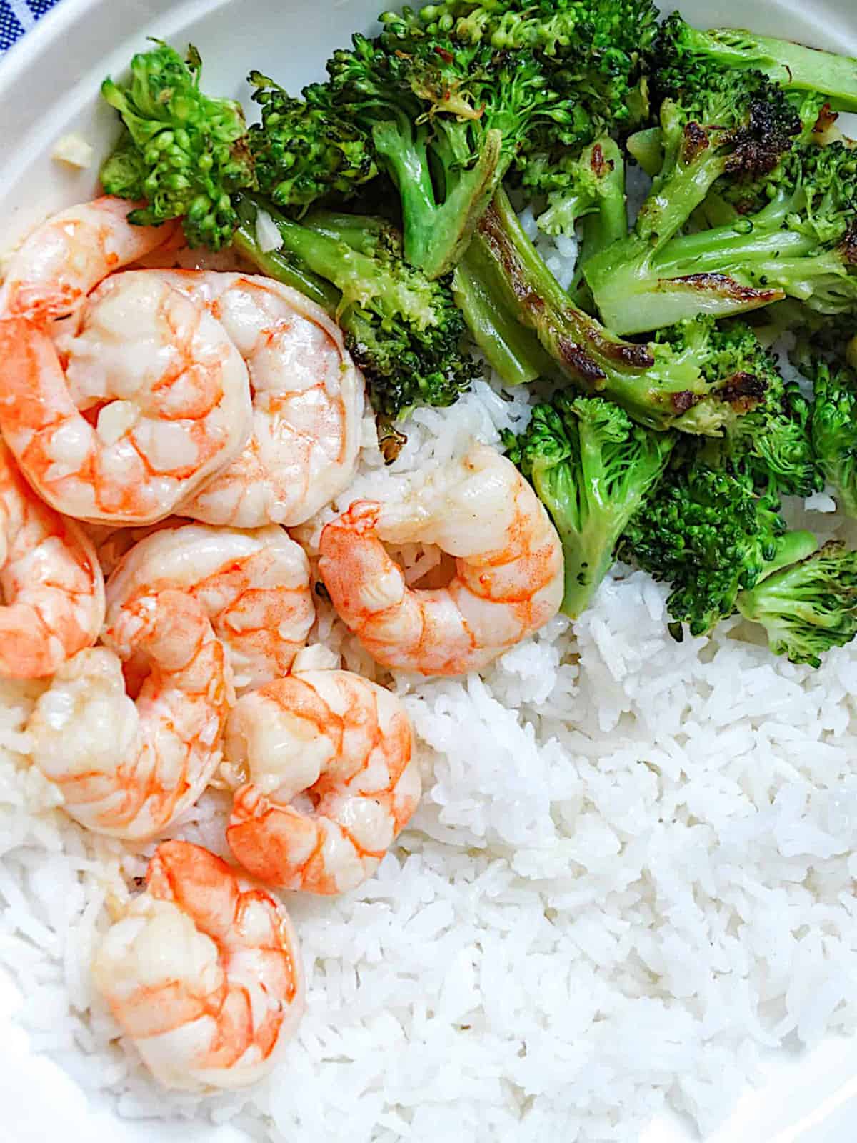 broccoli and shrimp with rice in a plate