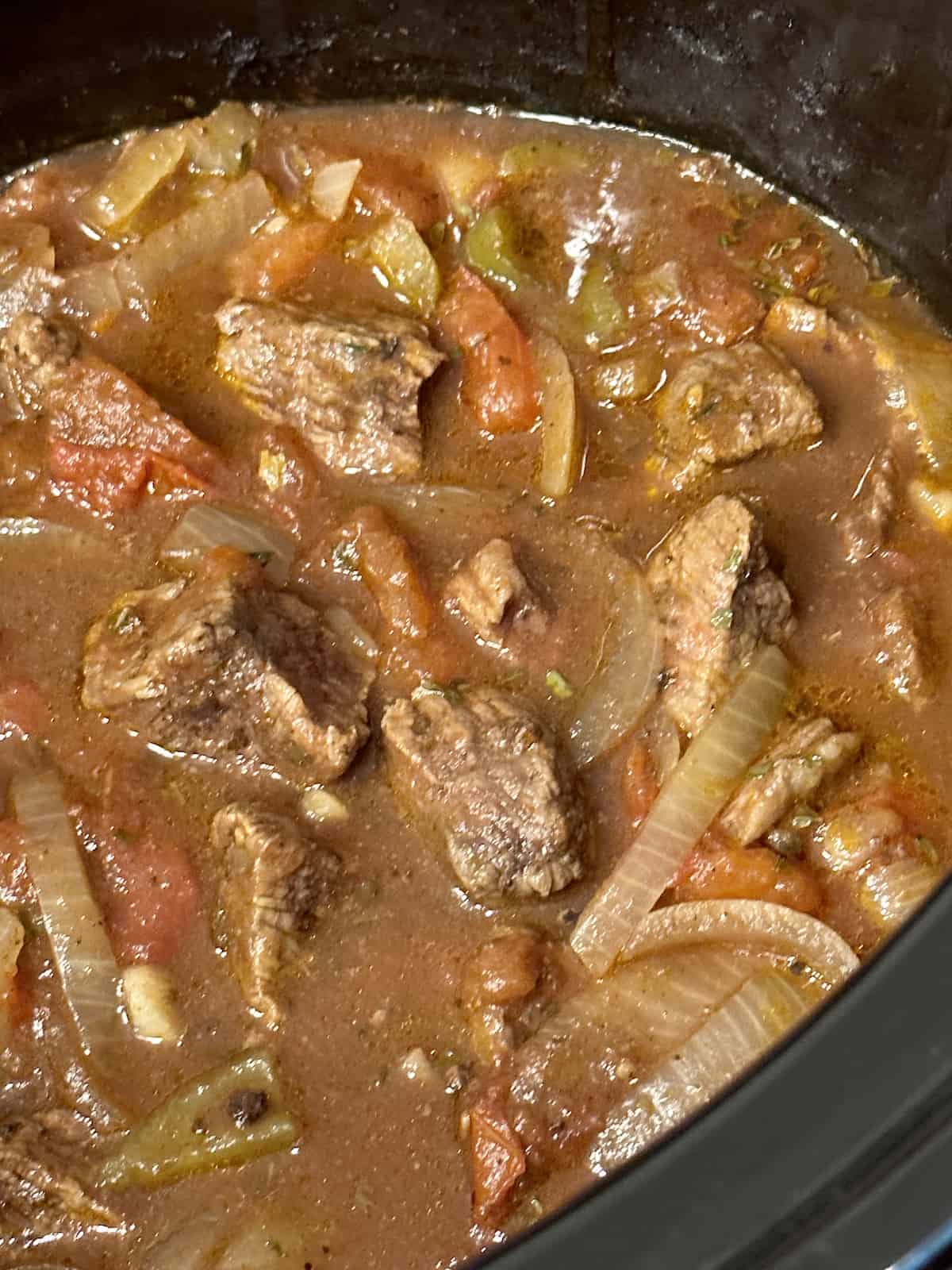 cooked vegetables and beef in a crockpot