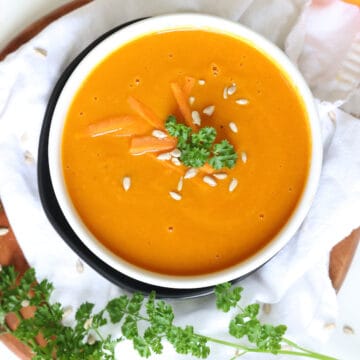 slow cooker carrot soup in a serving bowl