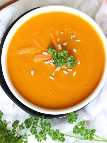 slow cooker carrot soup in a serving bowl