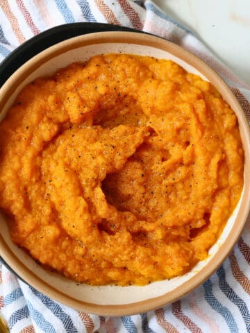 slow cooker mashed sweet potatoes in a bowl