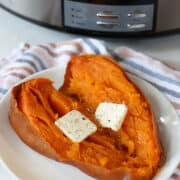 slow cooker sweet potato topped with butter
