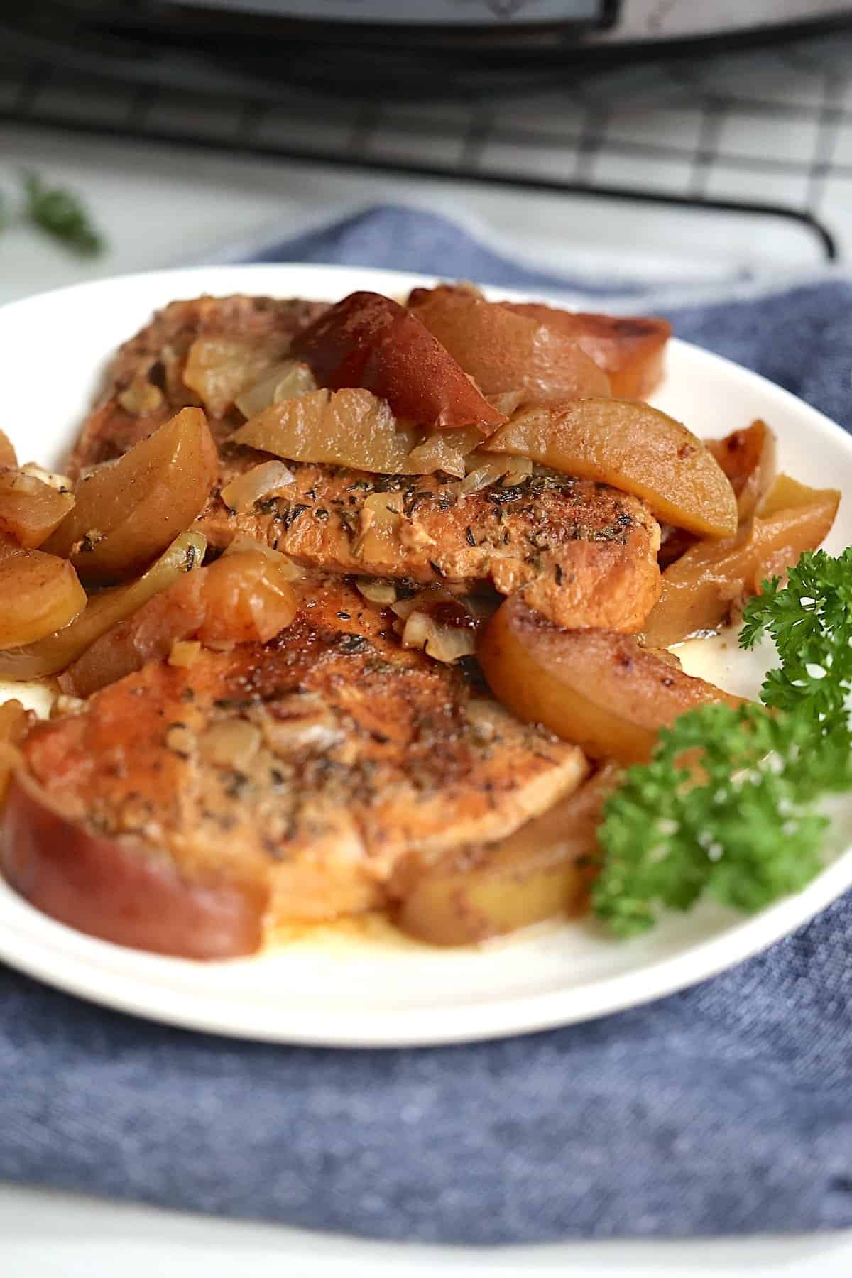 crock pot pork chops and apples on a plate