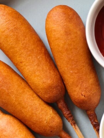 air fried corn dogs in a grey plate