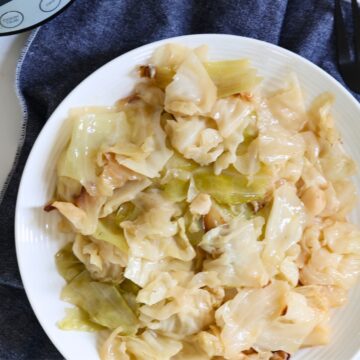 crockpot cabbage in butter on a white plate