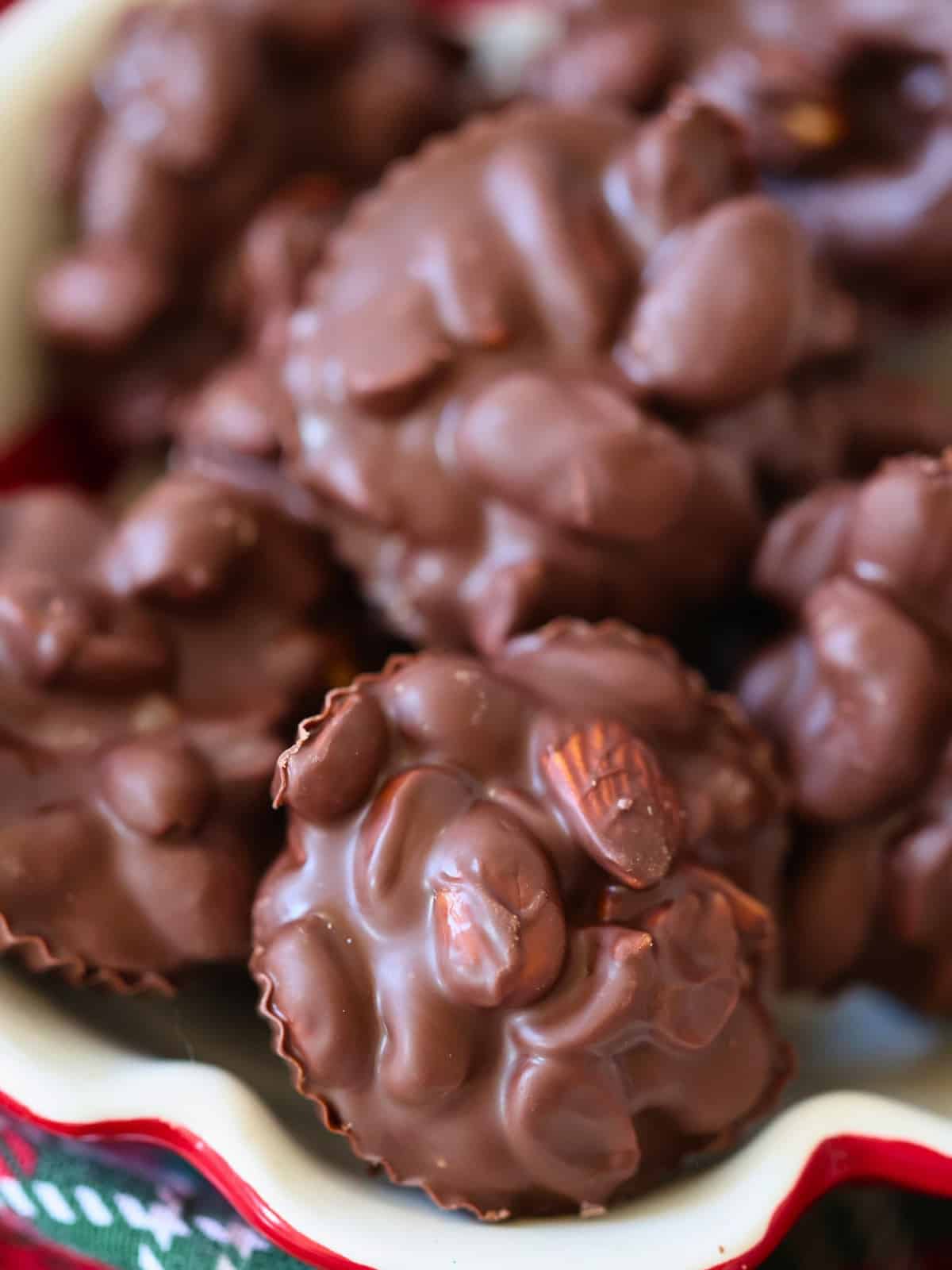 chocolate covered peanut clusters in a bowl
