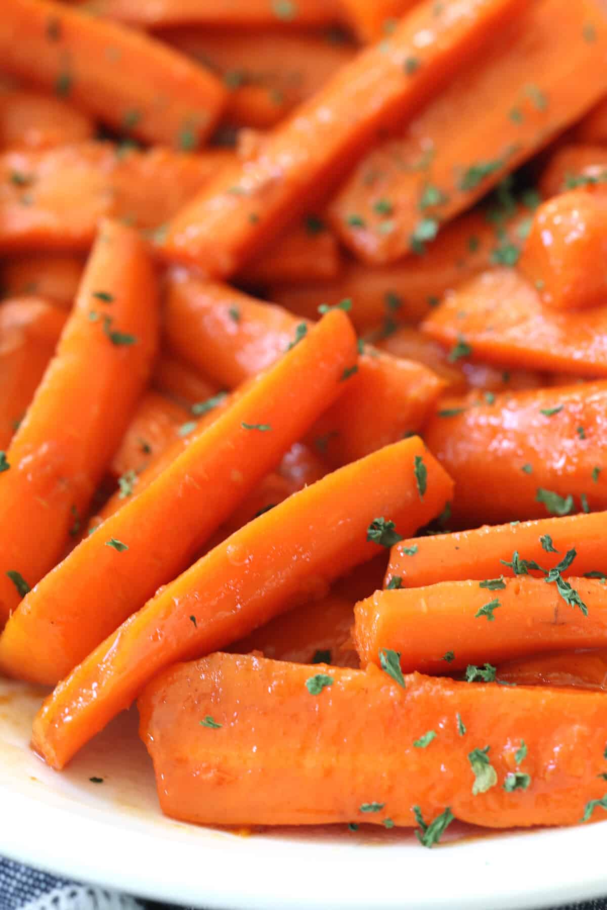 Instant Pot carrots with herbs and butter on a white plate