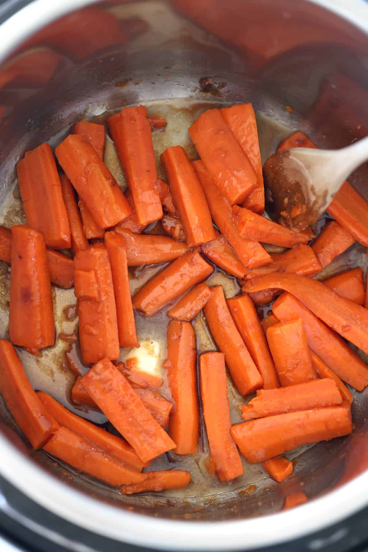 Instant Pot carrots mixed with a buttery brown sugar glaze